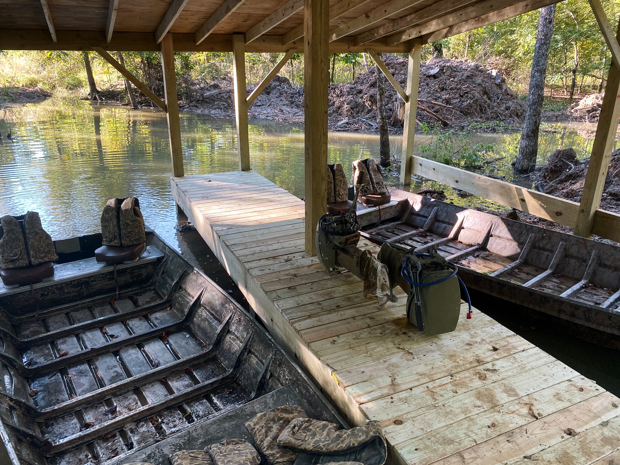 Boat dock with ditches leading to some of the best green timber duck hunting in Arkansas.