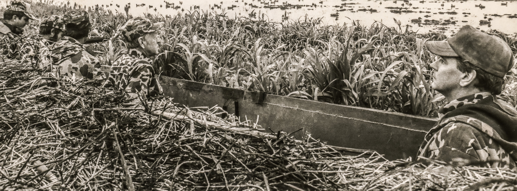 Vintage photo of hunters in the pit blind at Two Rivers Duck Club