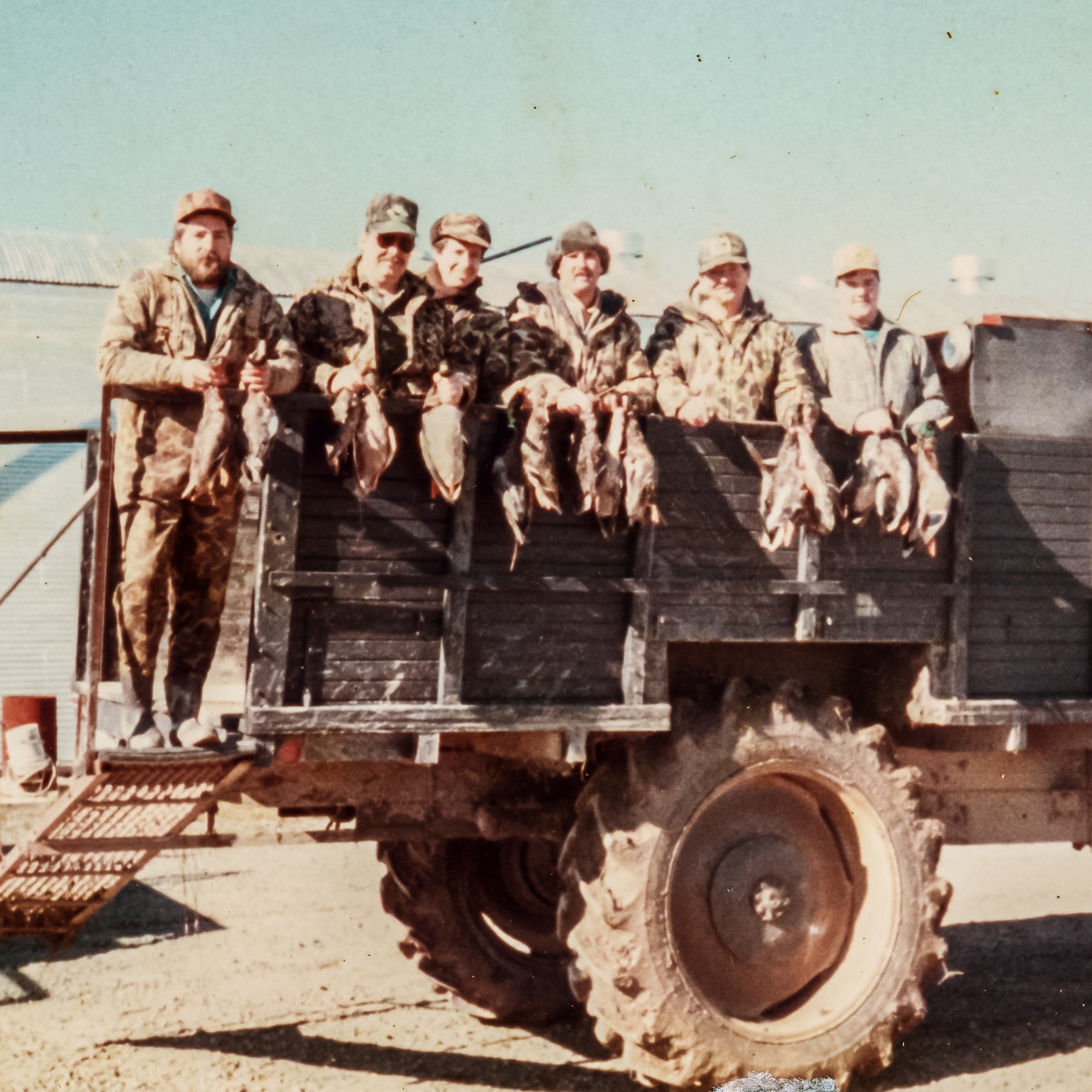 Hunters proudly showing off their limits of green-timber mallards after a succesfull day of hunting at Two Rivers Duck Club